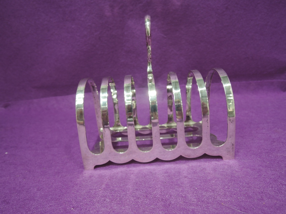 A Victorian silver six slice toast rack of traditional arch form, Sheffield 1893, Martin Hall &
