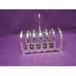 A Victorian silver six slice toast rack of traditional arch form, Sheffield 1893, Martin Hall &