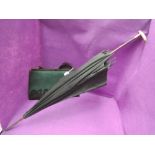 A lady's vintage black silk parasol having a mother of pearl handle and a bottle green and black