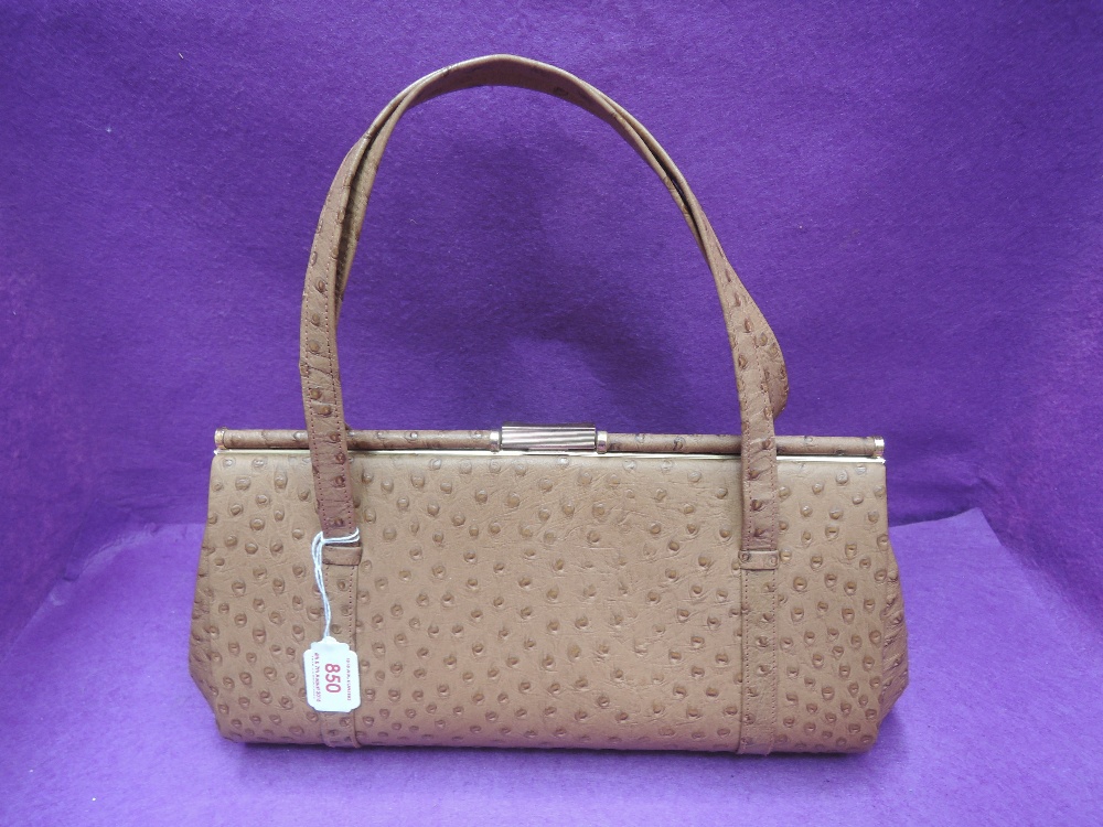 A vintage Ostrich leather tan bag by Ackery of London having clip clasp