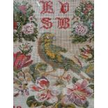 A 19th woolwork sampler of pictorial bird and foliage design, dated 1874