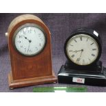 A Victorian ebonized treen mantel clock having roundel face and Roman numeral dial and an