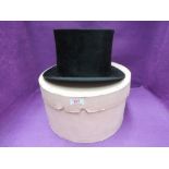 A gents black top hat retailed by S Cooke of Lancaster having cream leather and silk lining with