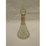 A cut glass perfume bottle of conical form having HM silver collar and cut glass stopper