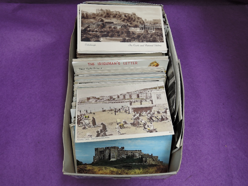 A box of several hundred mixed age postcards