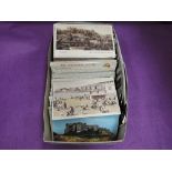 A box of several hundred mixed age postcards