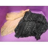 An early 20th century flapper style black net dress overlay having extensive bead and sequin