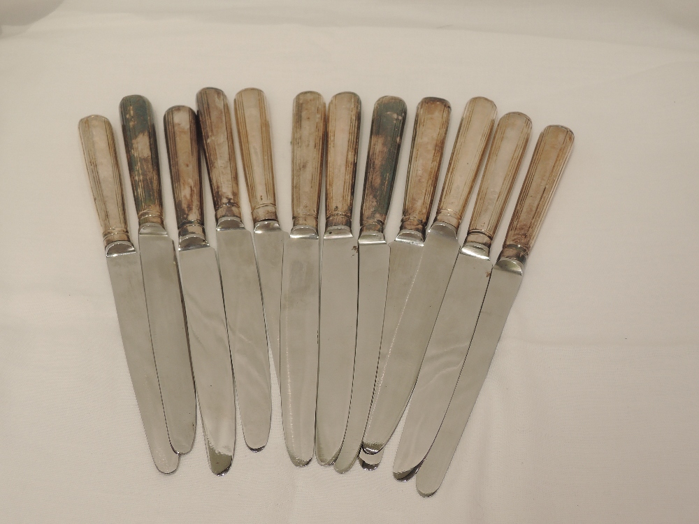 Twelve Georgian/Victorian silver handled dinner knives having later blades, London 1798/99, Moses