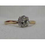 A lady's dress ring having a rose cut diamond solitaire, approx .75ct in a claw mount on a yellow