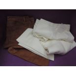 A pair of lady's 1970's tan suede trousers retailed by Harrods, and a pair of lady's cream wool