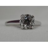 A lady's diamond solitaire dress ring, approx 1.2ct brilliant cut in a four claw raised mount on