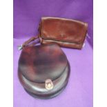 A brown leather shoulder bag by The Bridge with matching wallet purse, and a stiff leather saddle