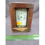 An early 20th century brass French carriage clock of traditional four glass design, on bun feet,