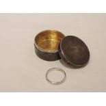 A small HM silver lidded trinket box of circular form having engine turned decoration containing