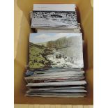 A box of several hundred mainly vintage postcards