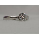A lady's dress ring having a diamond solitaire, approx 0.55ct in a four point claw mount on a