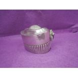 A Victorian silver sugar bowl having hinged lid, gadrooned decoration and lion mask handles,