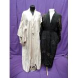 A black silk kimono style dressing gown having gold braid cloud decoration to front and extensive