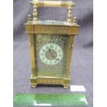 A 19th century brass frame carriage clock having reeded and blind fret decoration with silvered