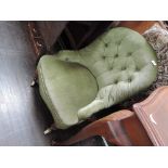 A Victorian tub low seat chair in later 20th century moss green dralon upholstery on turned legs