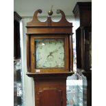 A late 18th century oak longcase clock having swan neck and pillar hood containing painted face