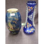 A Carlton ware vase of bulbous design having Bleu Royal ground and Oriental pictorial decoration,