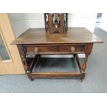 A 19th century oak low side table in 18th century style having rectangular top with frieze drawer
