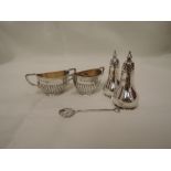 A pair of Victorian silver salts of urn form having gadrooned decoration and architectural