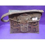 A vintage snakeskin handbag of structured form