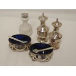 A pair of Victorian silver salts of oval form having gallery sides with ribbon and swag detail on