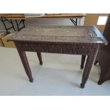 A 19th century oak side table having foliate and chip carved decoration with rectangular top on