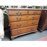 An early 19th century oak chest of 2 short and 3 long graduated drawers on bracket feet