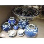 An early 20th century blue and white willow pattern wash bowl and a selection of early 20th