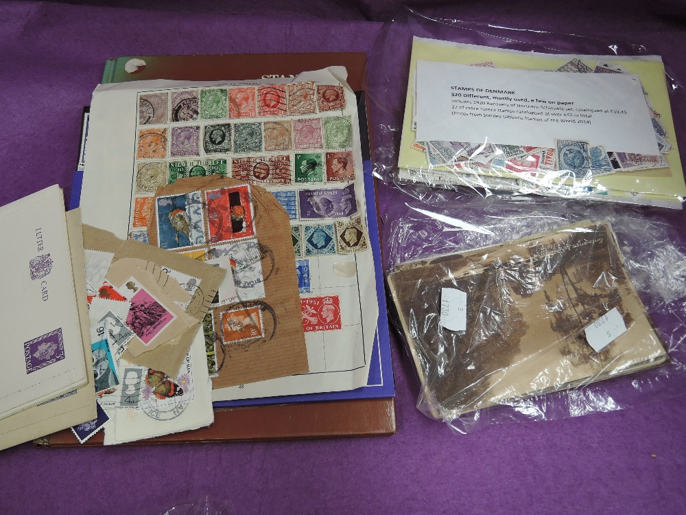 A small collection of stamps and postcards