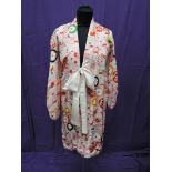 A Chinese style kimono having floral decoration on pink ground