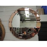 A 1930's Art Deco wall mirror of petal peach design