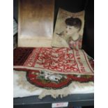 A beaded tapestry piece depicting roses on red ground and a Victorian sampler signed Victoria