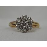 A lady's dress ring having a stylised diamond cluster, total approx 0.4ct in a stepped claw set