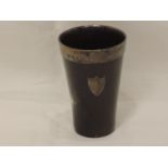 A Victorian horn beaker having clear base, silver rim and plain shield cartouche, Birmingham 1887,