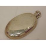 A silver hip flask of plain oval form, Chester 1912, makers mark worn