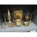 A selection of brass wares including a dinner gong