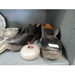 A pair of traditional shoe clogs approx size 9 and decorative curling stone