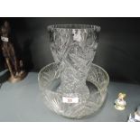 A heavy set and cut glass bowl and similar vase