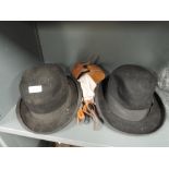 A selection of vintage mens dress items including braces and bowler hats one by Sam Cooke the Hatter