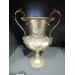 A vintage trophy possibly livestock related with bull design