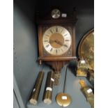 A vintage wall mounted clock marked Tempus Fugil