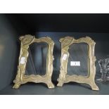 A pair of vintage brass cast photo frames with art nouveau design