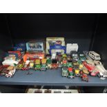 A shelf of mixed diecasts including Matchbox, Franklin Mint etc, some boxed