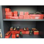 Two shelves of Hornby tin plate 0 gauge including Passenger coach, Goods brake van, Lumber wagon,