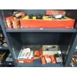 Two shelves of Hornby/Triang 00 gauge including RC train part set, two locomotives, rolling stock,